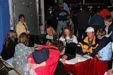 People working at the pilot equine survey computer stations.