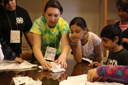 College Student Volunteer Leaders Work with Eat, Grow, Lead 4-H Club Members